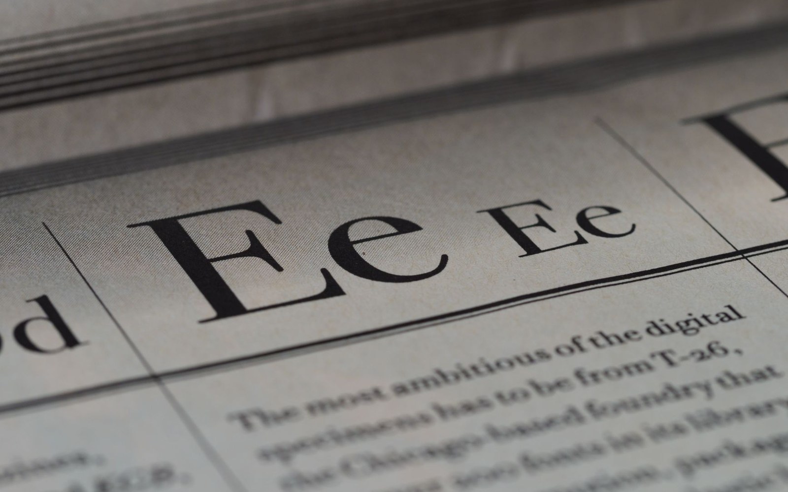Close-up of a printed newspaper page showing large serif letter "Ee" specimens